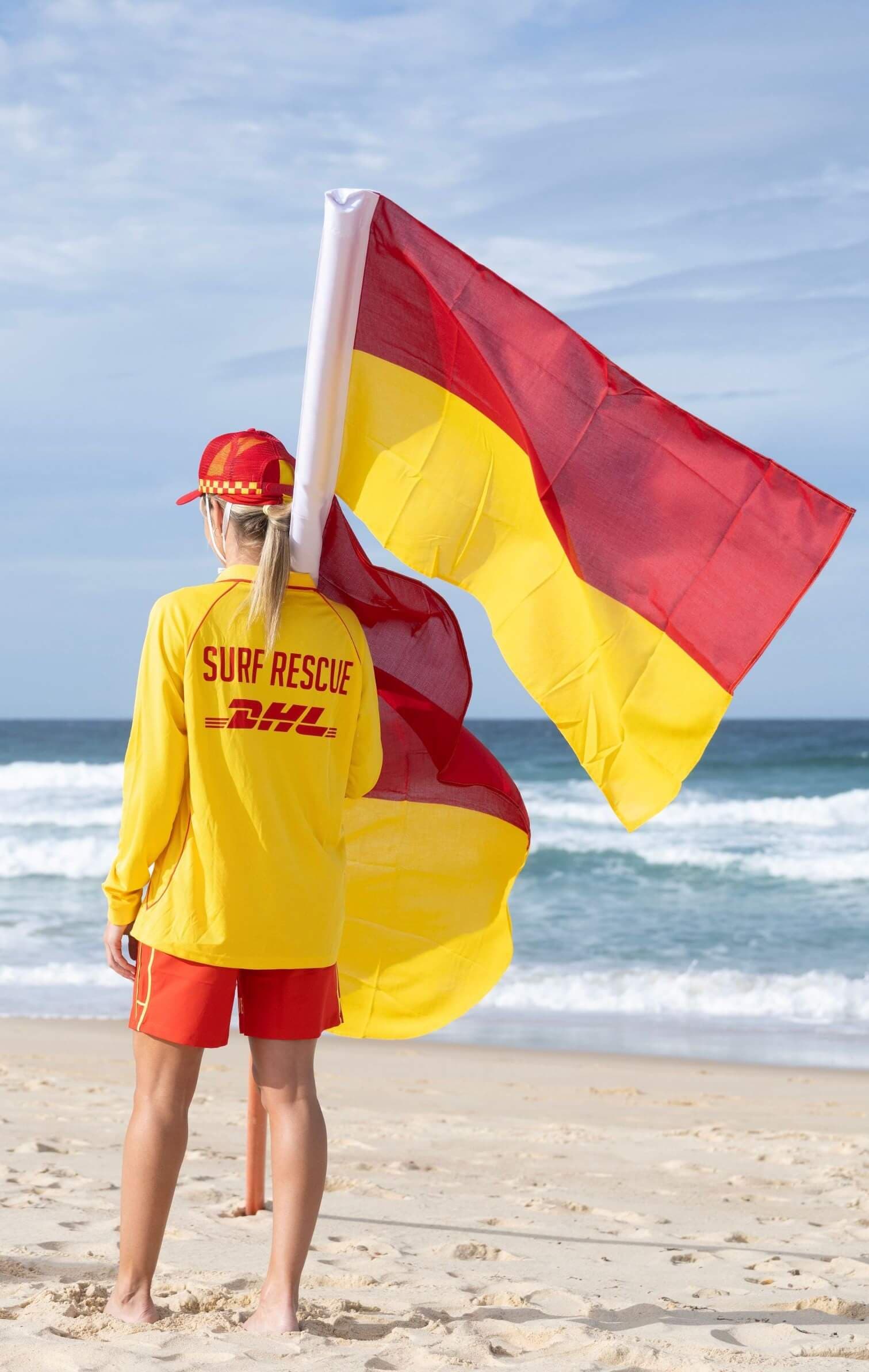 Lifesavers pulling on their red and yellow caps